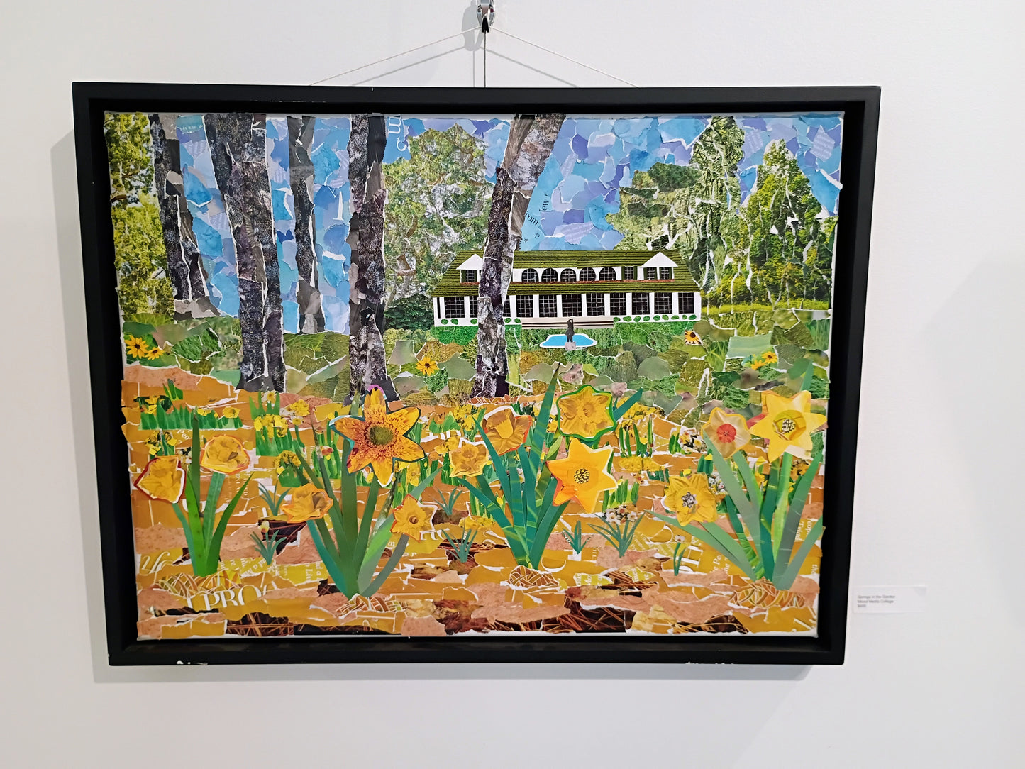 The original canvas framed and hanging in a gallary