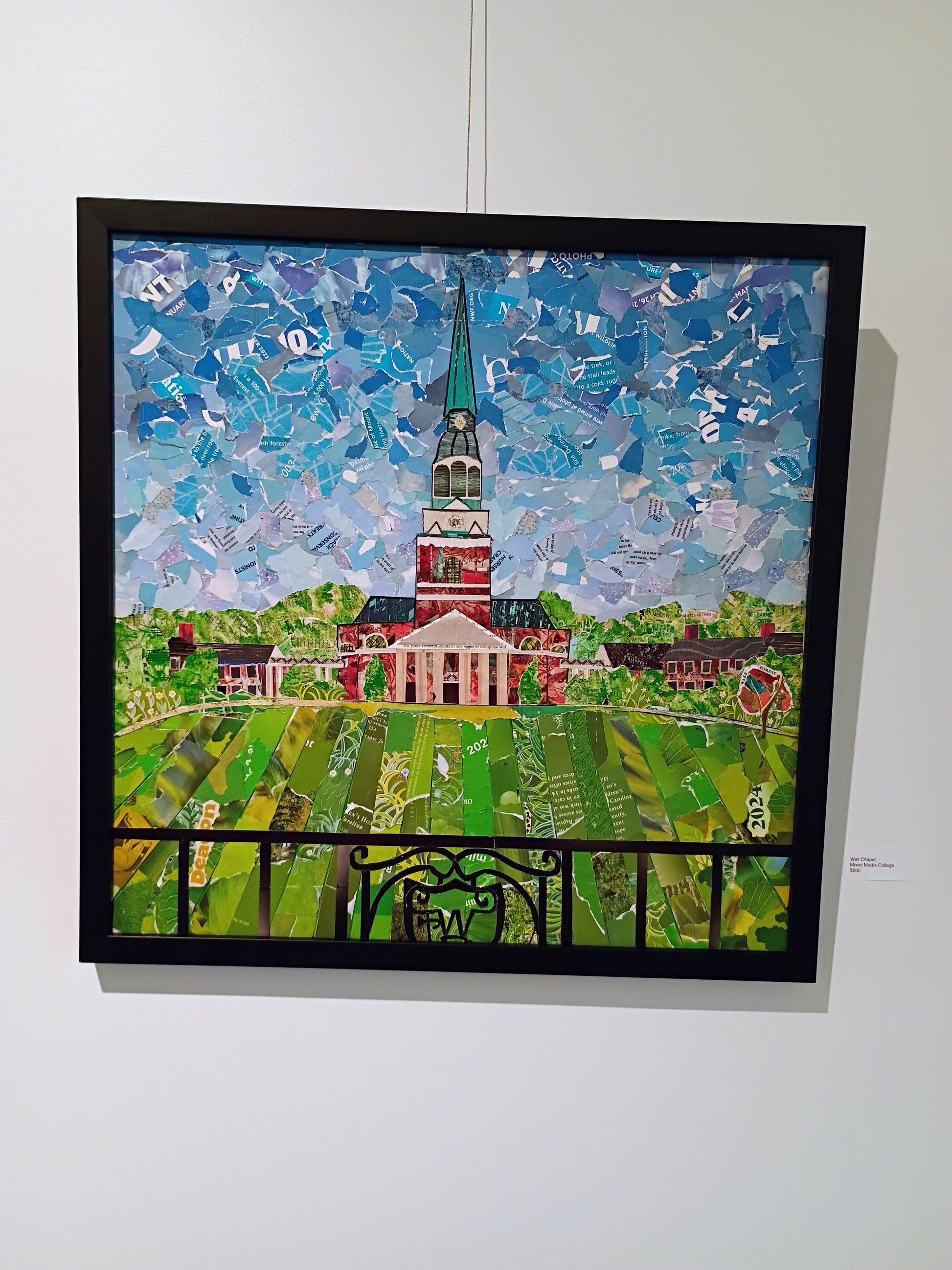 The original framed canvas hanging in an exhibit